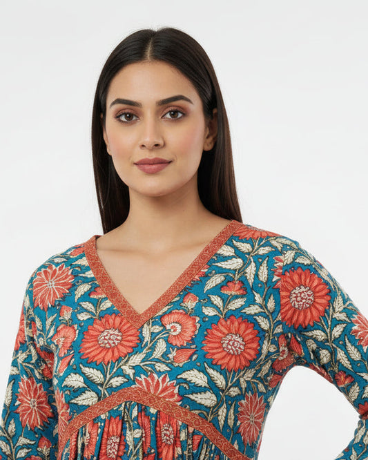 Floral patterned fabric with red and blue colors on a neutral background