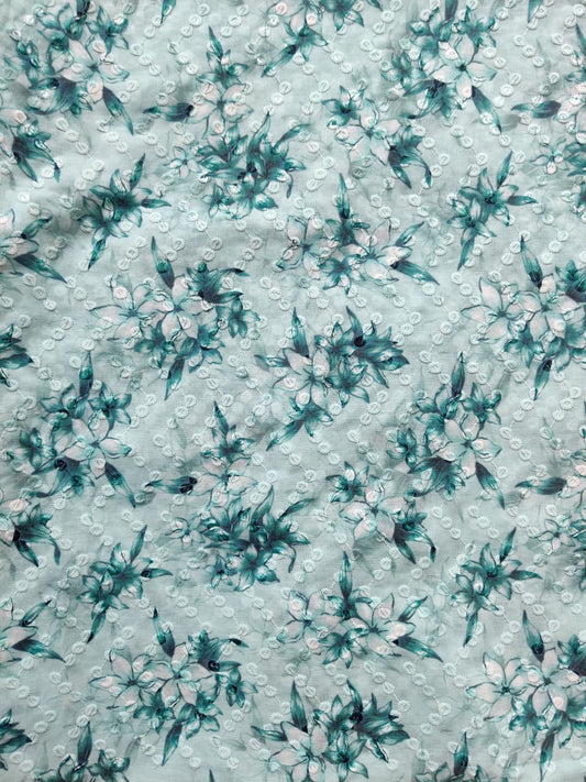 Teal floral pattern on a light blue background