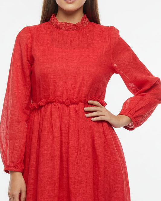 Red dress with black belt on a mannequin against a neutral background