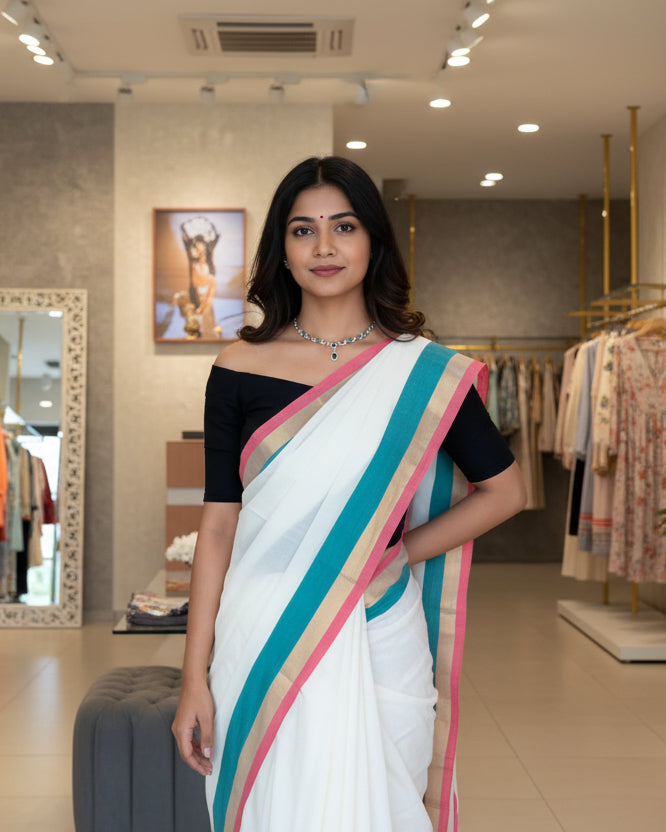 White saree with colorful stripes on a mannequin against a blurred background
